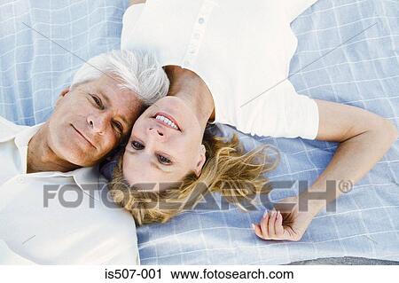 Couple lying down together View Large Photo Image Stock Image - Couple lying down together. Fotosearch