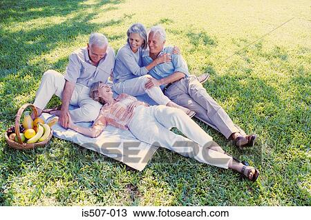 Stock Image - Friends in the park. Fotosearch