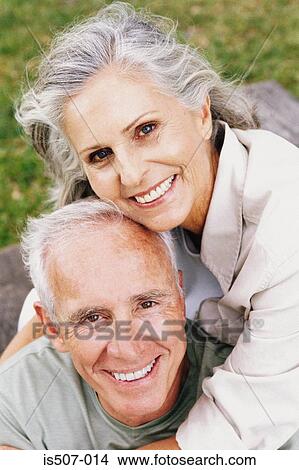 Picture - Intimate couple in park. Fotosearch
