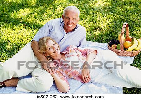 Intimate couple in park View Large Photo Image Stock Image - Intimate couple in park. Fotosearch