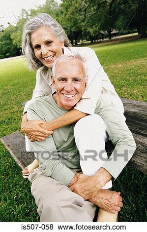 Intimate couple in park View Large Photo Image Stock Photo - Intimate couple in park. Fotosearch