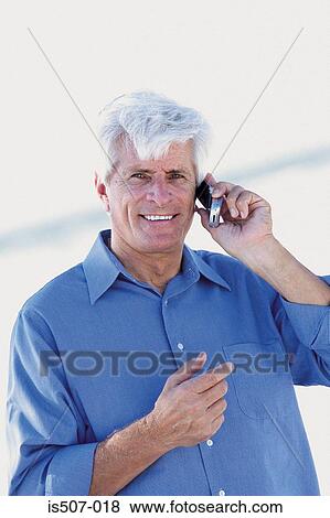 Stock Photo - Man on cellphone. Fotosearch