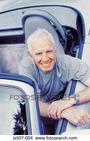 Man with his porche convertable View Large Photo Image Picture - Man with his porche convertable. Fotosearch