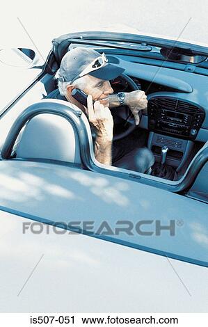 Stock Image - Man with his porche convertable. Fotosearch