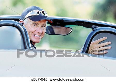 Man with his porche convertable View Large Photo Image Stock Photography - Man with his porche convertable. Fotosearch