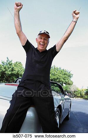 Man with his porche convertable View Large Photo Image Stock Photography - Man with his porche convertable. Fotosearch
