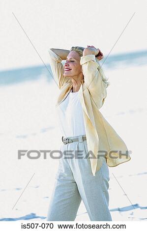 Woman stretching by the sea View Large Photo Image Stock Image - Woman stretching by the sea. Fotosearch