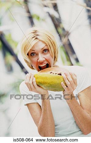 Woman eating outdoors View Large Photo Image Picture - Woman eating outdoors. Fotosearch