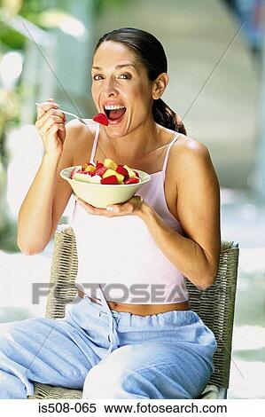 Woman eating outdoors View Large Photo Image Stock Photography - Woman eating outdoors. Fotosearch