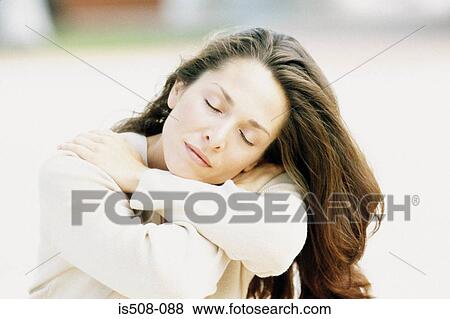 Woman relaxing outdoors View Large Photo Image Stock Photo - Woman relaxing outdoors. Fotosearch