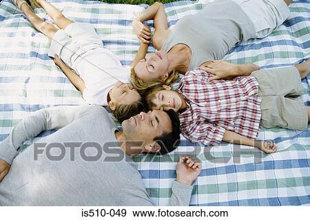 Stock Photo - Family lying down sleeping. Fotosearch