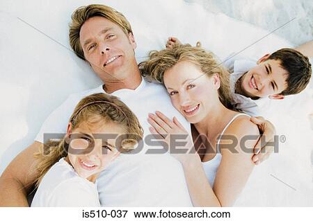 Stock Photo - Family lying down . Fotosearch