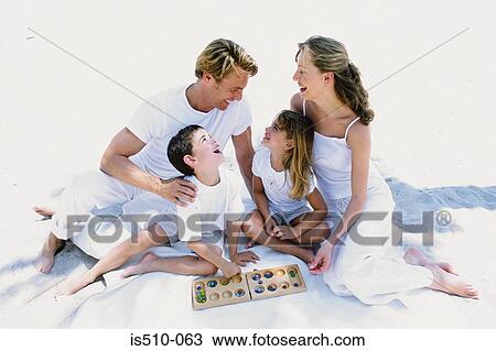 Family playing a game View Large Photo Image Stock Image - Family playing a game. Fotosearch