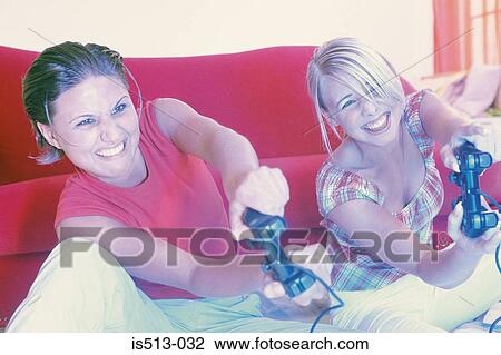 Stock Image - Girlfriends at home. Fotosearch