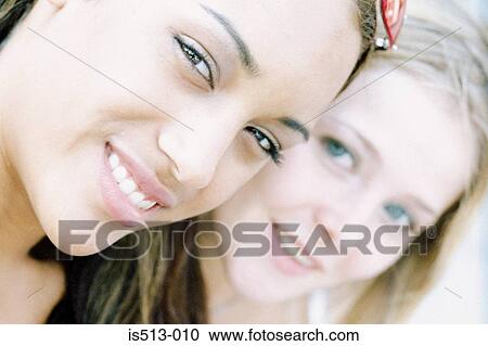 Young women smiling View Large Photo Image Stock Image - Young women smiling. Fotosearch