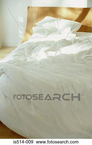 Stock Photo - Empty bed. Fotosearch