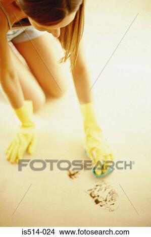 Woman cleaning floor stain View Large Photo Image Picture - Woman cleaning floor stain. Fotosearch