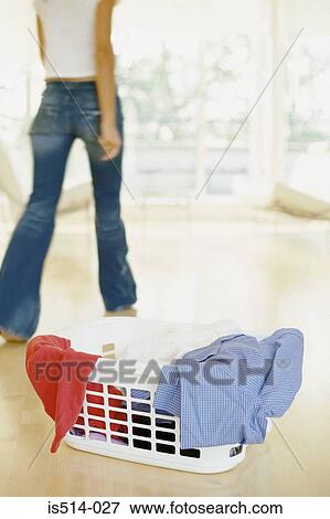Woman doing laundry View Large Photo Image Stock Photo - Woman doing laundry. Fotosearch