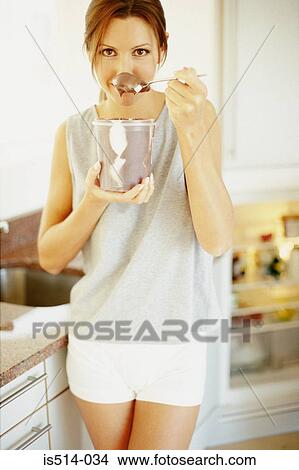 Woman eating View Large Photo Image Picture - Woman eating. Fotosearch