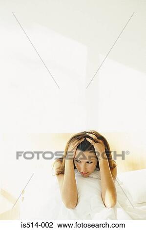 Woman holding her head View Large Photo Image Stock Image - Woman holding her head. Fotosearch