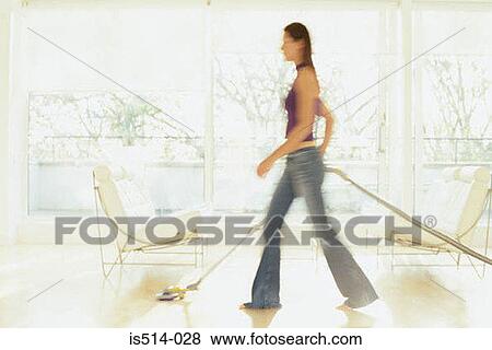 Woman hoovering View Large Photo Image Stock Photo - Woman hoovering. Fotosearch