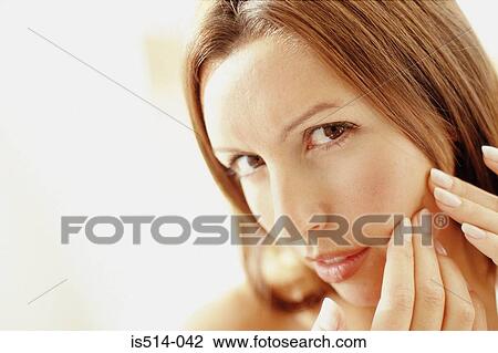 Woman looking in mirror View Large Photo Image Stock Image - Woman looking in mirror. Fotosearch