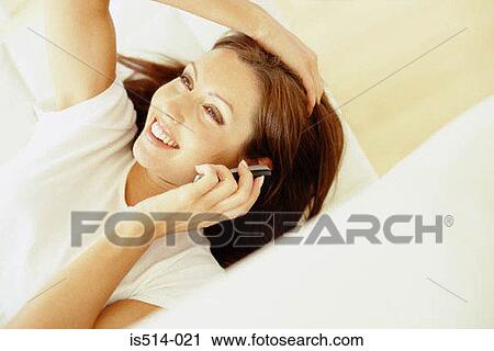 Woman talking on cellphone View Large Photo Image Stock Image - Woman talking on cellphone. Fotosearch