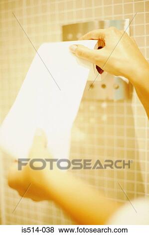 Woman unrolling lavatory paper View Large Photo Image Stock Photo - Woman unrolling lavatory paper. Fotosearch