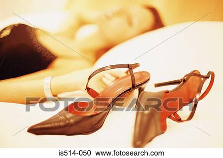 Stock Image - Woman with her stilettos. Fotosearch