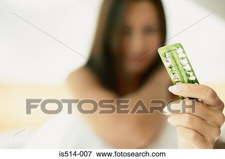 Stock Photo - Woman with the pill. Fotosearch