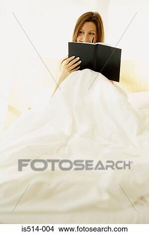 Picture - Woman writing a diary. Fotosearch
