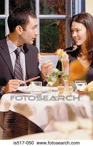 Couple eating out View Large Photo Image Stock Image - Couple eating out. Fotosearch