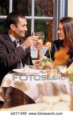 Stock Photo - Couple eating out. Fotosearch