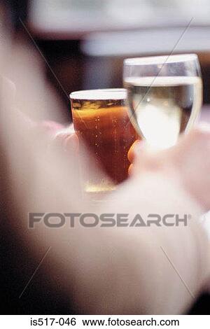 Couple having a drink View Large Photo Image Stock Photograph - Couple having a drink. Fotosearch