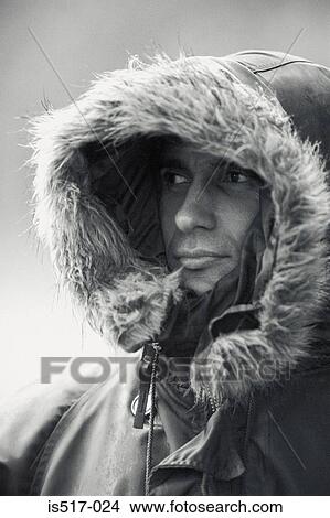 Picture - Man wrapped up in parka. Fotosearch