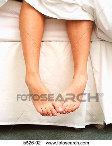 Stock Image - A woman getting up. Fotosearch