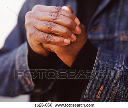 Stock Image - Cracking knuckles. Fotosearch