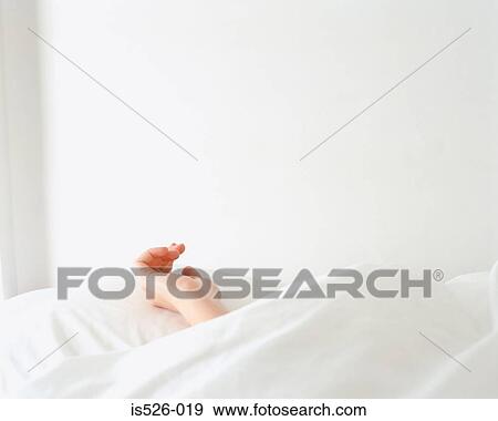 Hand of a female resting on a pillow View Large Photo Image Stock Photo - Hand of a female resting on a pillow. Fotosearch