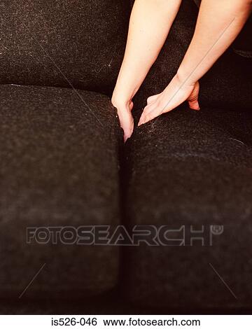 Lost in between cushions View Large Photo Image Stock Photograph - Lost in between cushions. Fotosearch