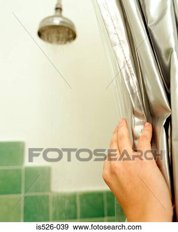 Woman holding a silver shower curtain View Large Photo Image Stock Photo - Woman holding a silver shower curtain. Fotosearch
