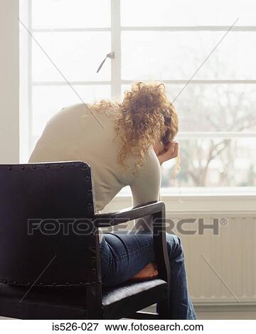 Woman holding her head View Large Photo Image Stock Photo - Woman holding her head. Fotosearch