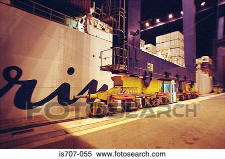 Part of the base of a container crane by a cargo ship View Large Photo Image Stock Photography - Part of the base of a container crane by a cargo ship. Fotosearch