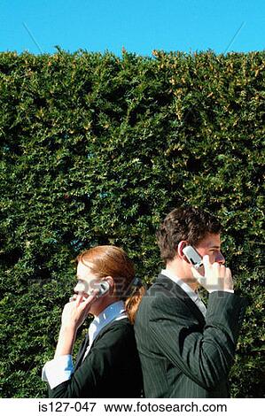 Business people on their mobile phones View Large Photo Image Stock Photo - Business people on their mobile phones. Fotosearch