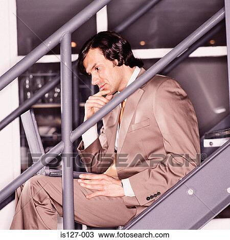 Businessman working on a laptop View Large Photo Image Stock Image - Businessman working on a laptop. Fotosearch