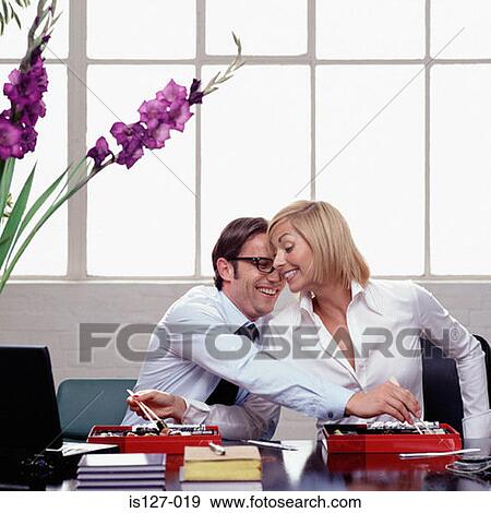 Eating and flirting at work View Large Photo Image Stock Photo - Eating and flirting at work. Fotosearch