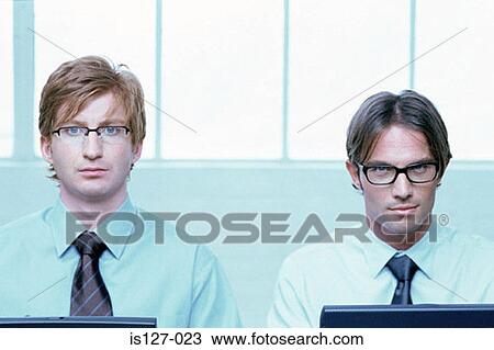 Two businessmen working View Large Photo Image Stock Image - Two businessmen working. Fotosearch