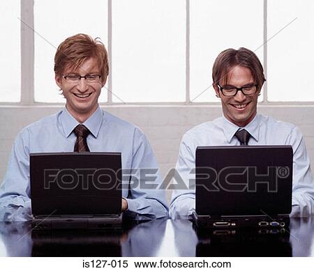 Two businessmen working View Large Photo Image Stock Photography - Two businessmen working. Fotosearch