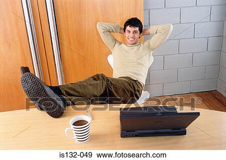 Businessman with feet on desk View Large Photo Image Stock Photo - Businessman with feet on desk. Fotosearch