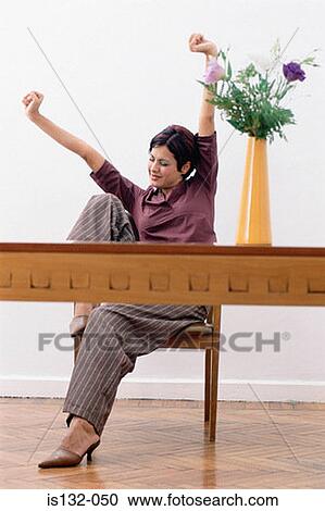 Stock Image - Businesswoman stretching. Fotosearch