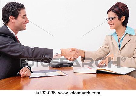 Stock Photograph - Man and woman shaking hands. Fotosearch